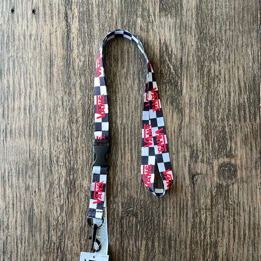 Vans Black & White checkered Lanyard, with clip on the bottom to hold keys. NWT